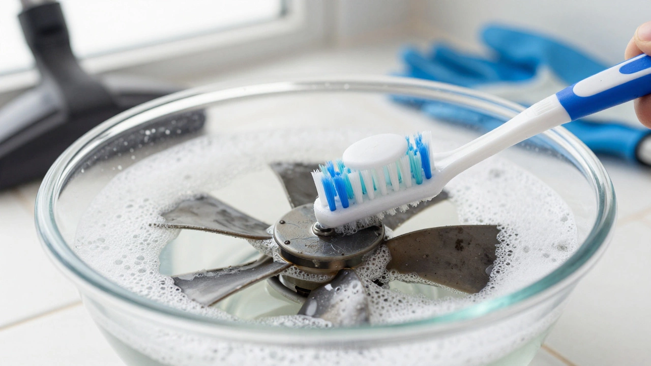 Toothbrush cleaning a dusty fan impeller in a bowl of soapy water